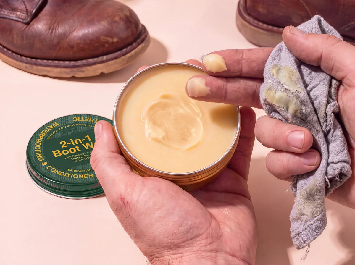 Boot Wax warmed into a paste on the fingers, with a rag, beside a pair of leather boots