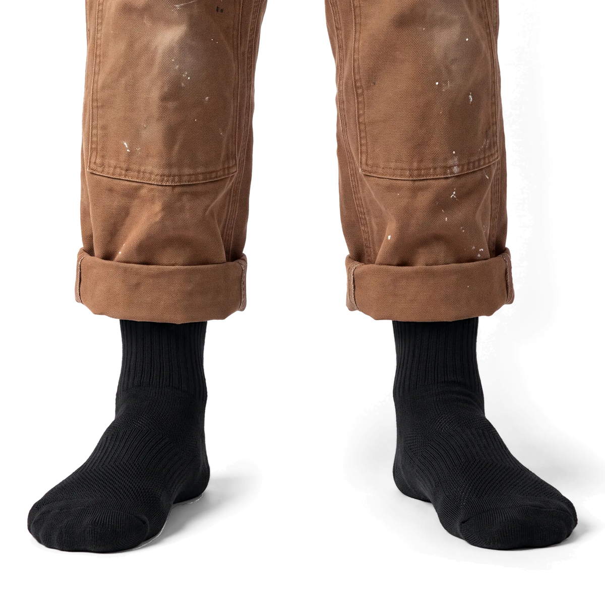 Black Merino Boot Socks worn with canvas work pants, front view